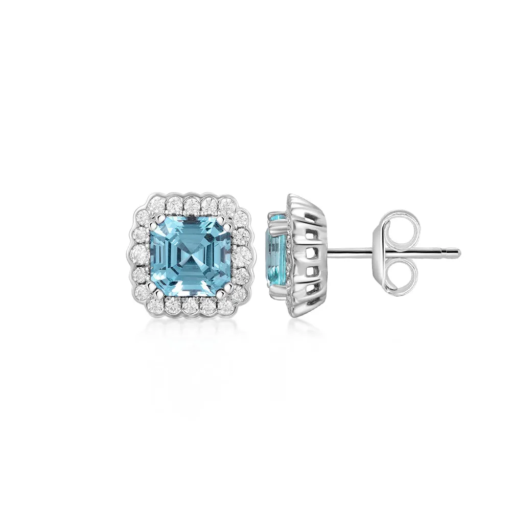 Asscher and Round Brilliant halo stud earrings with blue topaz simulants and 0.42 carats* of diamond simulants in sterling silver